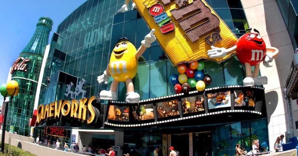 A large M&M’s and Coca-Cola advertising display is visible outside the M&M’s World store in Las Vegas.